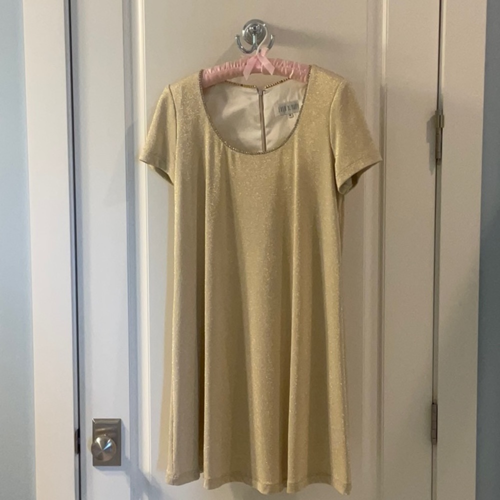 Fun, flowing cocktail dress with golden sparkle.